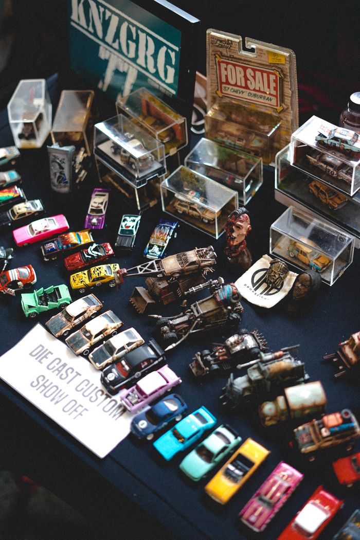 about-img A colorful collection of die-cast cars displayed at a toy showcase event.