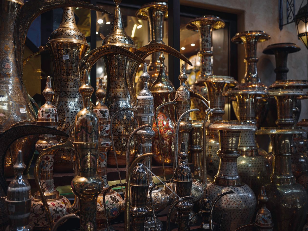 ours-journey Discover intricately designed brassware in a charming antique shop setting, showcasing timeless artistry.