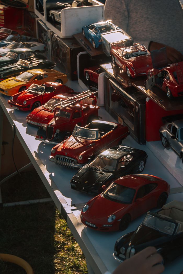 our-experience Vintage model cars in a vibrant outdoor exhibition, capturing a nostalgic essence.